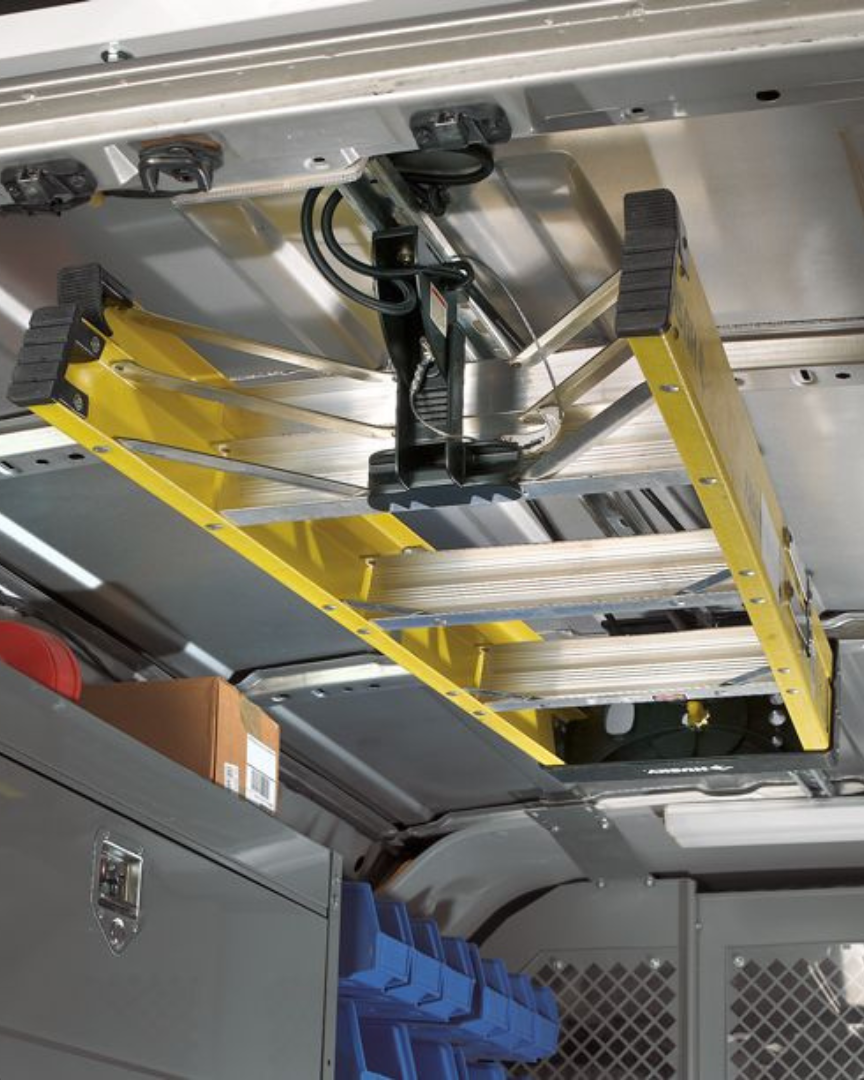 JET Rack holding a ladder in the ceiling of an american van