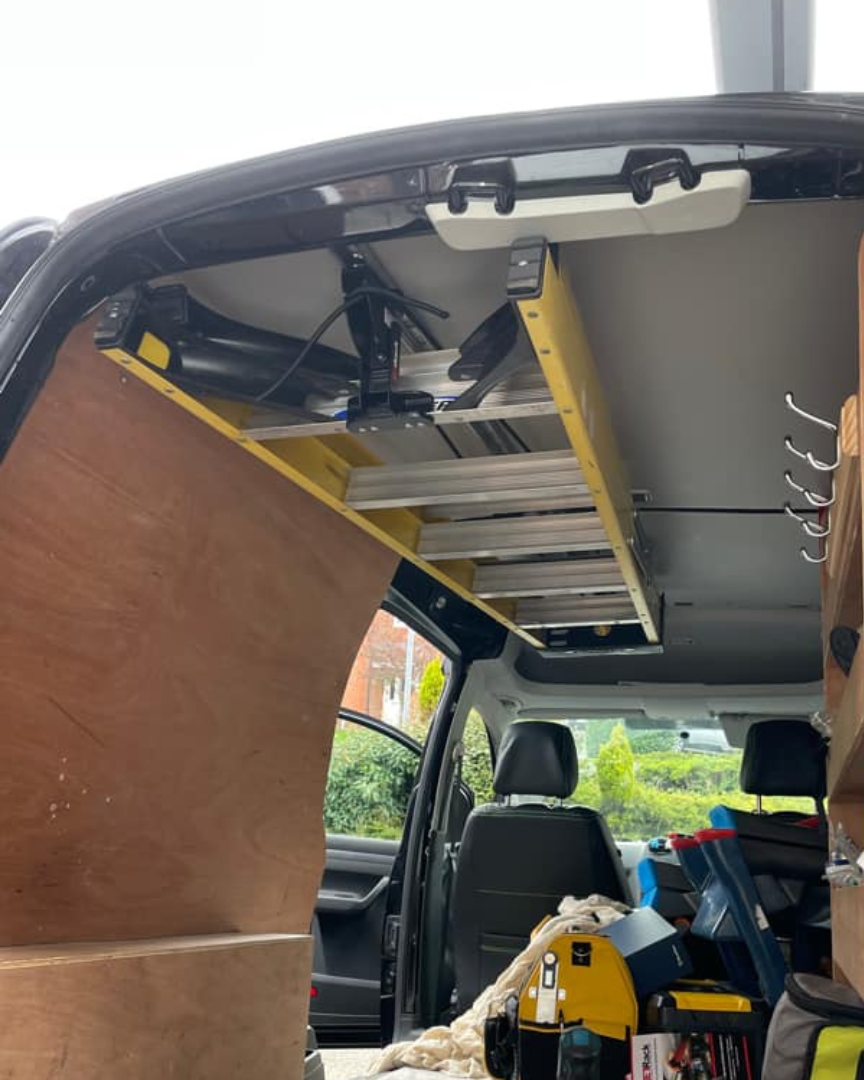 JET Rack holding a ladder installed into a Volkswagen Caddy Maxi